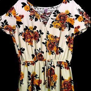 Super cute cream floral N/B dress. 31 inches long.